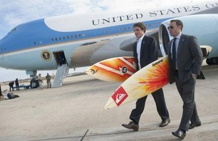 President Barack Obama's Assistants Carrying His Surfboards