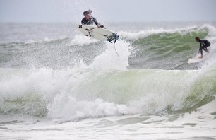 Timmy Curran holds on for a hard landing.