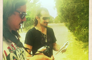 Director and writer Simon Chan getting down and dirty with Peacy on location in the great expanse. 