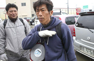 Japanese Surfer Rescues Wife From Tsunami