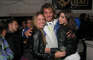 Jordy Smith with two lovely ladies at Modern Collective premiere